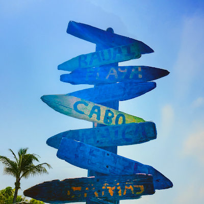 Directional sign with arrows to beaches